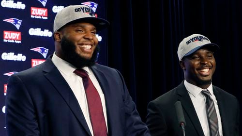 New England Patriots first-round NFL draft picks, offensive lineman Isaiah Wynn (left) and running back Sony Michel laugh during a media availability, Friday, April 27, 2018, in Foxborough, Mass.