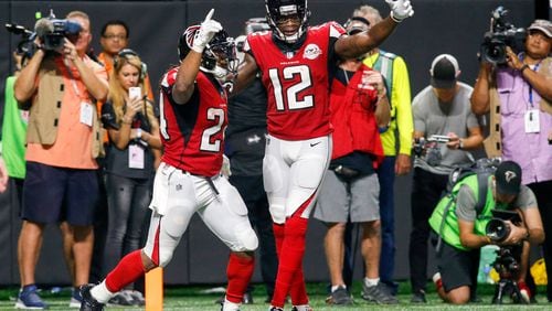 Atlanta Falcons running back Devonta Freeman, left, celebrates a touchdown with wide receiver Mohamed Sanu in a Week 2 win over the Green Bay Packers.