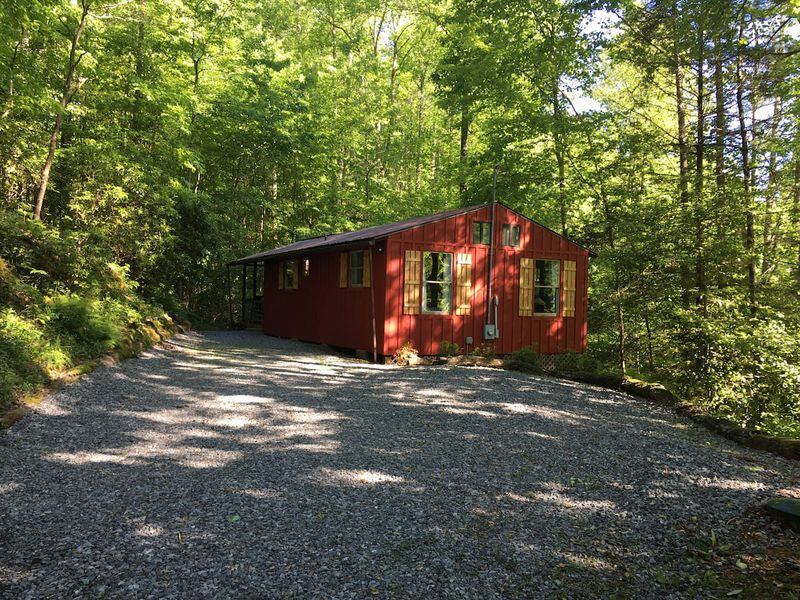 This is the little red cabin in the woods in springtime, which offers amazing views in the fall.