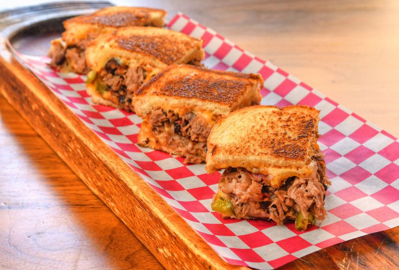 Dixie Q’s Brisket Grilled Cheese with Caramelized Onions and Poblano Peppers was developed by Scott Serpas, pitmaster and owner of Brookhaven’s Dixie Q. It was the Judge’s Choice Winner at the 2019 Atlanta Grilled Cheese Festival. CONTRIBUTED BY CHRIS HUNT PHOTOGRAPHY