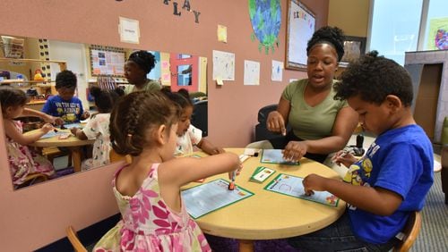 May 3, 2018 Atlanta - Ashton Aiken teaches her preschool students (clockwise from left) Maria Lopez, Annapurna Barakoti and Kiyan Flagg, all 4 years old, at Sheltering Arms International Village Center on Thursday, May 3, 2018. Sheltering Arms International Village Center is one of the few facilities where low-income parents can enjoy quality early childhood education through state subsidies. HYOSUB SHIN / HSHIN@AJC.COM