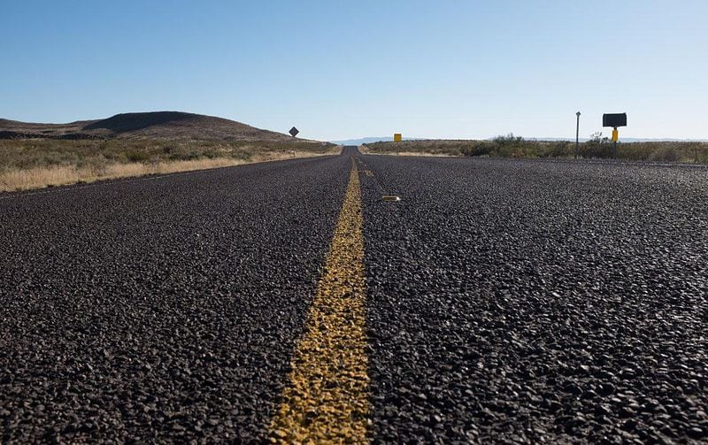 A low angle view of an empty US-180 highway near the New Mexico border, Texas. (Photo by Epics/Getty Images)
