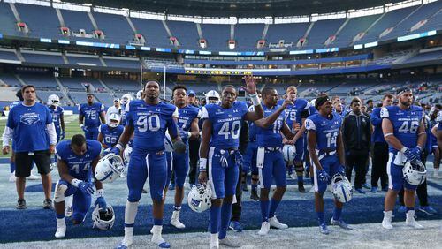 November 25, 2017 - Atlanta, Ga: Georgia State Panthers players react to the band after their game against the Appalachian State Mountaineers at GSU Stadium Saturday, November 25, 2017, in Atlanta. Appalachian State Mountaineers won 31-10. PHOTO / JASON GETZ