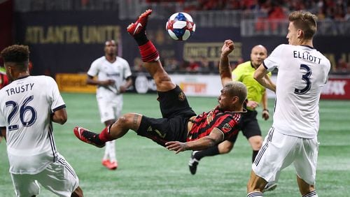 **** VISUAL LEDE **** March 17, 2019 Atlanta: Atlanta United forward Josef Martinez makes a bicycle kick between Philadelphia Union defenders Auston Trusty and Jack Elliott that was blocked by goalkeeper Andre Blake during the second half in a MLS soccer match that ended in a 1-1 draw on Sunday, March 17, 2019, in Atlanta.   Curtis Compton/ccompton@ajc.com