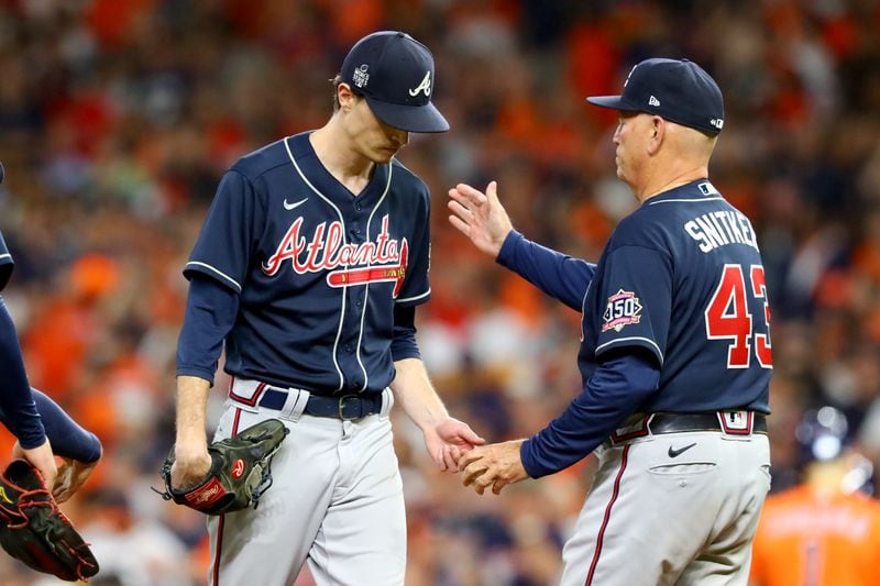 Braves starting pitcher Max Fried, left, is removed from the mound by manager Brian Snitker during the sixth inning against the Houston Astros in game 2 of the World Series at Minute Maid Park, Wednesday October 27, 2021, in Houston, Tx. Curtis Compton / curtis.compton@ajc.com 