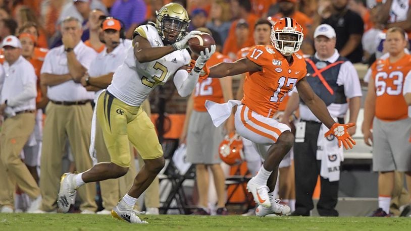 Georgia Tech defensive back Tre Swilling (3) intercepts a pass intended for Clemson wide receiver Cornell Powell (17)  at Memorial Stadium Thursday, Aug. 29, 2019, in Clemson, S.C.