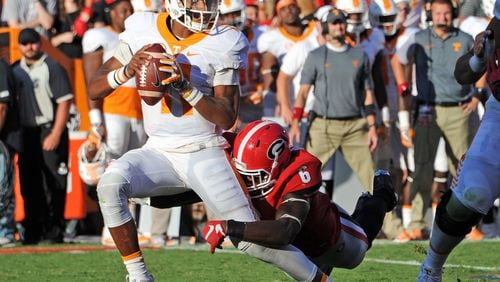 ATHENS, GA - OCTOBER 1: Joshua Dobbs #11 of the Tennessee Volunteers is sacked by Natrez Patrick #6 of the Georgia Bulldogs at Sanford Stadium on October 1, 2016 in Athens, Georgia. (Photo by Scott Cunningham/Getty Images)