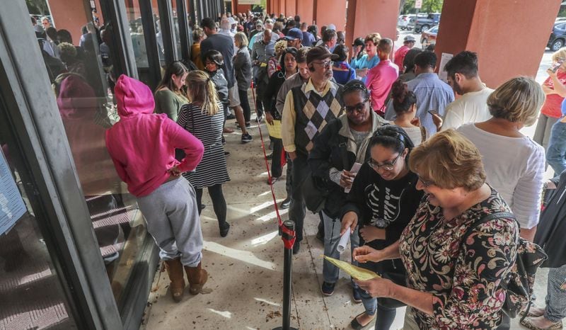 People lined up Thursday Oct. 18, 2018 at the Cobb County West Park Government Center at 736 Whitlock Ave NW in Marietta that had long lines and waits all week long for early voting that sometimes stretched to three hour waits. JOHN SPINK/JSPINK@AJC.COM