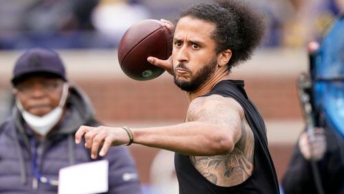 Colin Kaepernick throws during halftime of an NCAA college football intrasquad spring game at Michigan, on April 2, 2022, in Ann Arbor, Mich.  (AP Photo/Carlos Osorio, File)