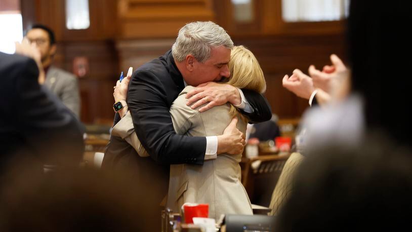 State Rep. Esther Panitch D-House District 51, and State Rep. John Carson, R-Marietta, embrace each other after the passing of the HB30 during Crossover Day at the Capitol in Atlanta on Monday, March 6, 2023. HB30 defines antisemitism so that it would be included under Georgia’s hate crimes law. 
Miguel Martinez /miguel.martinezjimenez@ajc.com