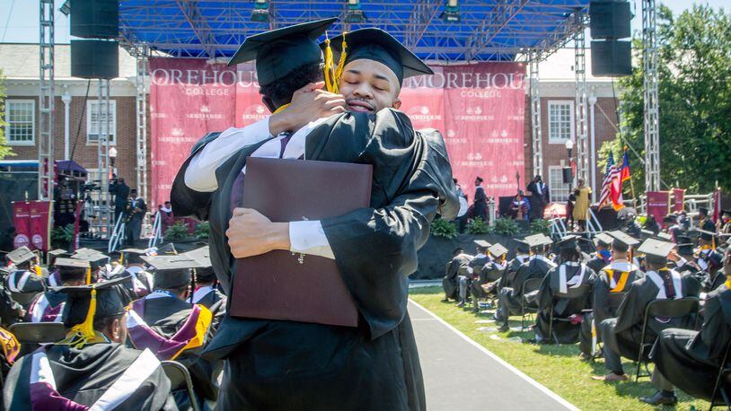 Graduates react after receiving their diploma during the 137th commencement that celebrates the classes of 2020 and 2021 on the Century Campus at Morehouse College on Sunday, May 16, 2021. (Photo: Steve Schaefer for The Atlanta Journal-Constitution)