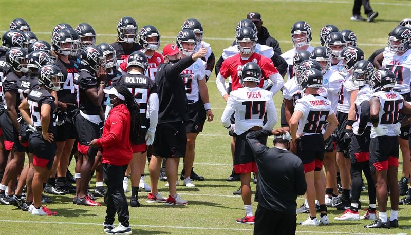 New Falcons head coach Arthur Smith (center, red hat) gathers players for some instruction during rookie minicamp Friday, May 14, 2021, in Flowery Branch. (Curtis Compton / Curtis.Compton@ajc.com)