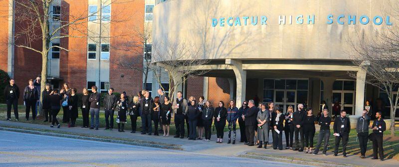 Before school today, Decatur High School teachers lined up outside the school in black to show their support for fired clerk Susan Riley. (Rick Brozek photo.)