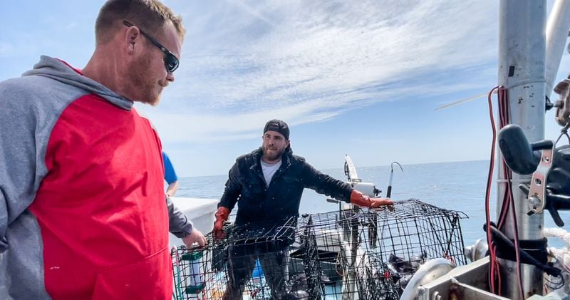 Capt. Michael Cowdrey and striker Landon Cruz fish for black sea bass with ropeless gear off the coast of North Carolina on March 5, 2022. SPECIAL to the AJC