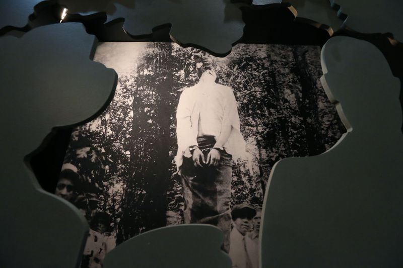 A life size lynching photo is framed by cutouts giving an illusion of being in the crowd. The Southern Museum of Civil War & Locomotive History is putting together the new exhibit "Seeking Justice: The Leo Frank Case Revisited." AJC photo: BOB ANDRES/BANDRES@AJC.COM