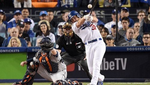 Charlie Culberson of the Dodgers hits a single during the eighth inning against the Astros in Game 6 of the 2017 World Series at Dodger Stadium on October 31, 2017 in Los Angeles, California.  (Photo by Kevork Djansezian/Getty Images)