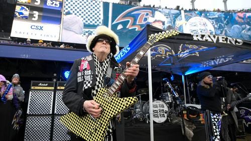 Rick Nielsen, left, and Robin Zander, right, of Cheap Trick perform during halftime of an NFL football game between the Pittsburgh Steelers and the Baltimore Ravens, Sunday, Jan. 9, 2022, in Baltimore. (AP Photo/Nick Wass)