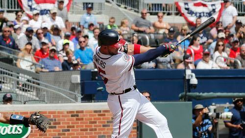 Braves catcher Tyler Flowers hits a single in the fifth inning against the Padres on Sunday. (AP Photo/John Bazemore)