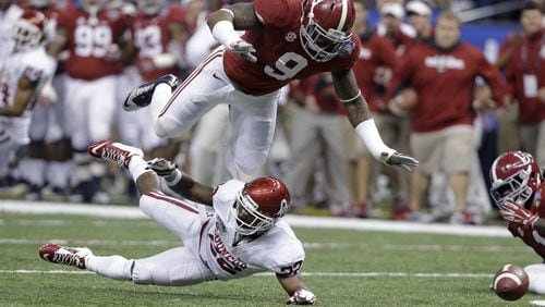 FILE - This Jan. 2, 2014, file photo shows Alabama linebacker Reuben Foster (9) hitting Oklahoma running back Roy Finch (22), resulting in an incomplete pass during the first half of the Sugar Bowl NCAA college football game in New Orleans. Vicious hitter who is probably too light to play middle linebacker in the NFL. Top-10 talent who might slip a bit because the value of linebackers who are not edge rushers is down in the NFL. He also was dismissed from NFL combine for argument with hospital worker. (AP Photo/Rusty Costanza, File)