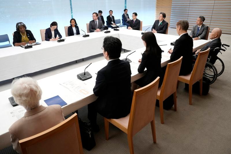U.S. Ambassador to United Nations Linda Thomas-Greenfield, top left, meets with Japan's Chief Cabinet Secretary Yoshimasa Hayashi, far right, and the families of abduction victims by North Korea Thursday, April 18, 2024, at prime minister's office in Tokyo. (AP Photo/Eugene Hoshiko, Pool)