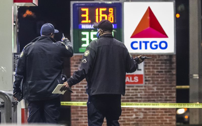 November 2, 2021 Atlanta: Atlanta police are investigating after a woman was found shot to death early Tuesday morning, Nov. 2, 2021 at a northwest Atlanta gas station. The shooting occurred along Sandy Creek Drive, but police responded to a Citgo gas station on Martin Luther King Jr. Drive shortly before 2 a.m. regarding the wounded woman. She was dead when officers arrived. Her name was not released. A gray Jeep was part of the crime scene and investigators had its doors open. Authorities did not say if the woman drove the Jeep from Sandy Creek Drive to the gas station or if she was found inside it. Police said witnesses at the gas station were cooperative but did not say if they saw the shooting. (John Spink / John.Spink@ajc.com)
