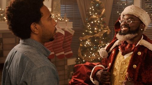 (L-R): Chris "Ludacris" Bridges as Eddie and Lil Rel Howery as Nick in DASHING THROUGH THE SNOW, exclusively on Disney+. Photo courtesy of Disney. © 2023 Disney Enterprises, Inc.. All Rights Reserved.