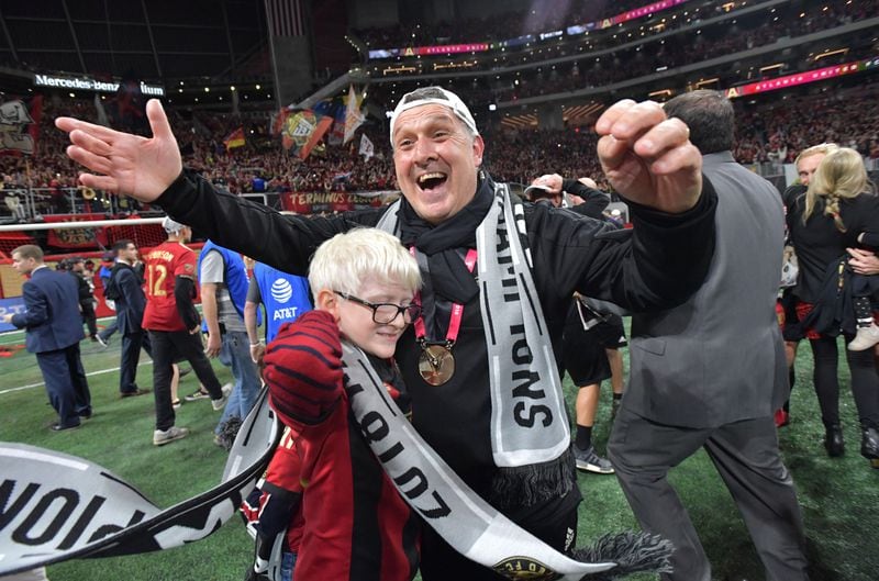 12/8/18 - Atlanta -  Atlanta United Coach Gerardo Martino celebrates on the field after the victory. The Atlanta United soccer team defeated the Portland Timbers for the MLS Cup, the championship game of the Major League Soccer League at Mercedes-Benz Stadium in Atlanta.  HYOSUB SHIN / HSHIN@AJC.COM