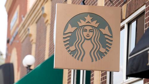 FILE - Starbucks sign hangs outside a casino along Main Street Wednesday, Sept. 20, 2023, in Deadwood, S.D. Starbucks will reports earnings on Tuesday, April 30, 2024. (AP Photo/David Zalubowski)