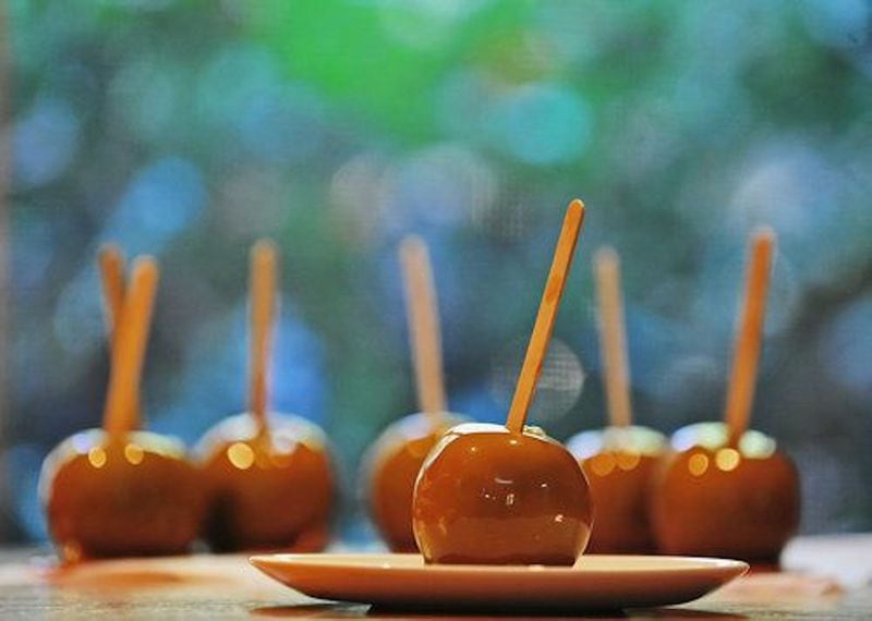 When he was a boy, writer Bill King used to eat the sweet coating off a caramel apple at the fair and then toss the remainder of the fruit. (AJC file)