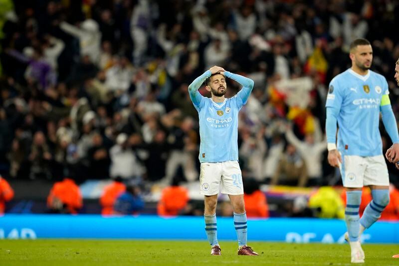 Manchester City's Bernardo Silva reacts after losing the Champions League quarterfinal second leg soccer match against Real Madrid at the Etihad Stadium in Manchester, England, Wednesday, April 17, 2024. (AP Photo/Dave Thompson)