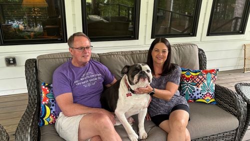 GHSA executive director Robin Hines and wife Kim, along with bulldog Elvis, enjoy the back deck on their home at Lake Hartwell.