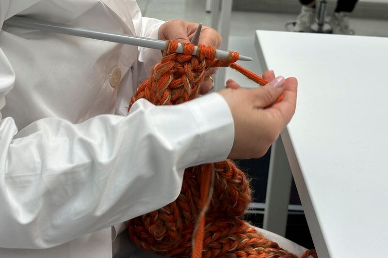 Italian artisans create knitwear for the Prada and Miu Miu brands at a recently expanded factory in the Perugia province of Italy Tuesday, May 7, 2024. The Prada Group is expanding its production footprint in Italy, including dozens of new jobs at brand's knitwear factory near Umbria, leaning into Made in Italy as integral to the brand's ethos as it develops new artisanal talent to ease the luxury group through a generational shift in its workforce, alongside the management and creative transitions already under way. (AP Photo/Colleen Barry)