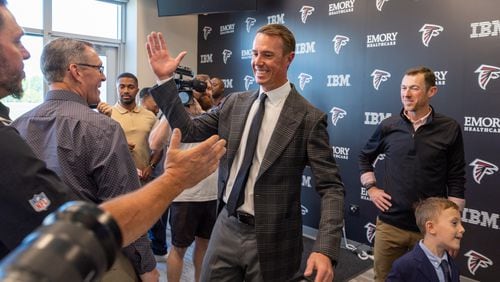 Falcons great Matt Ryan greets former teammate Todd McClure after announcing his retirement.