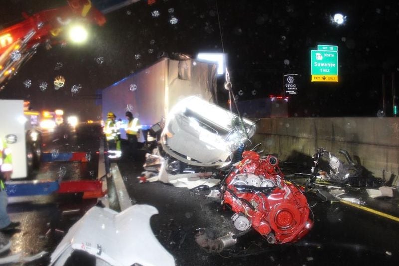 The drivers of two tractor-trailers were killed in Friday morning's crash, which shut down  I-85 in Gwinnett County for hours.