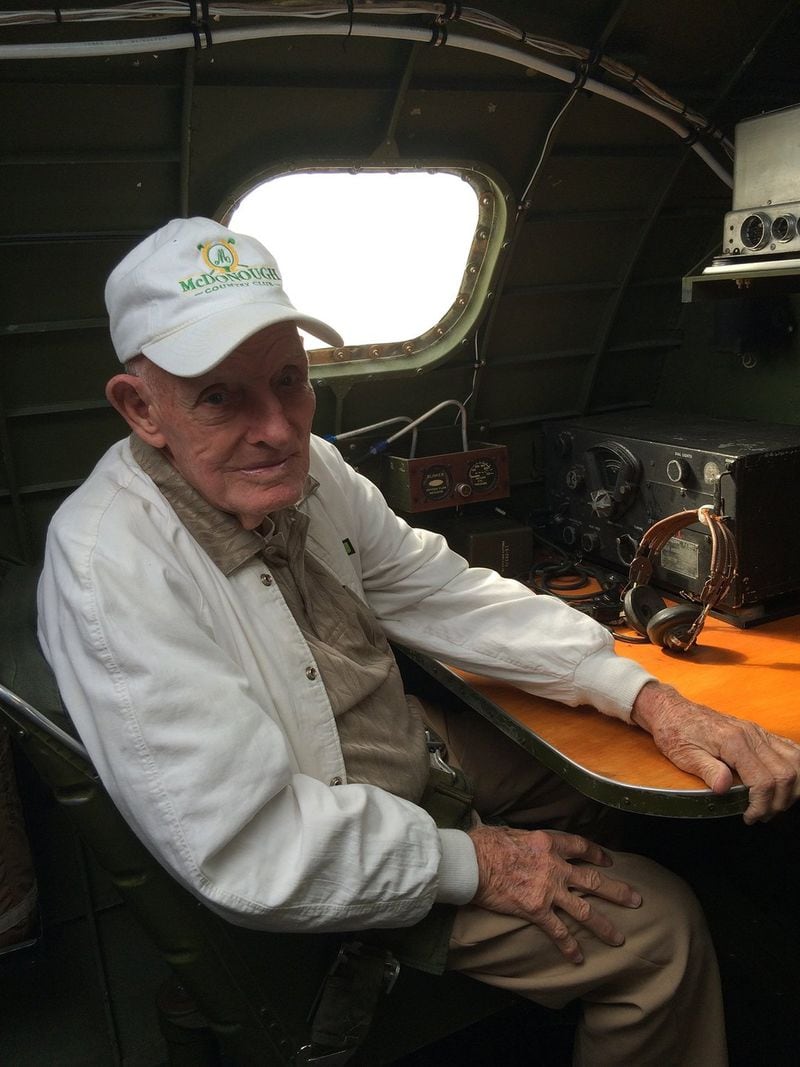 Larry McDonough seated on a B-17 Bomber. During World War II, Larry entered the United States Army-Air Force serving with the 863rd Bomber Squadron and with the Mighty 8th Air Force flying bombing missions over Nazi-held territories.