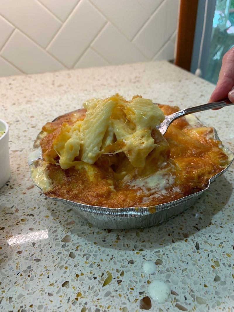 In recent years, writer Bill King’s family has celebrated Independence Day with takeout from Decatur’s Community Q, including the restaurant’s famous mac and cheese. CONTRIBUTED BY OLIVIA KING