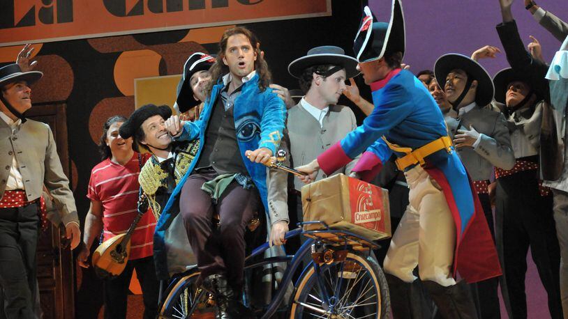 Figaro makes his entrance in the 2014 Opera Philadelphia production of “Barber of Seville.” The Atlanta Opera will use the same sets, costumes and direction (by Michael Shell) in its presentation of the Rossini classic. CONTRIBUTED BY KELLY AND MASSA