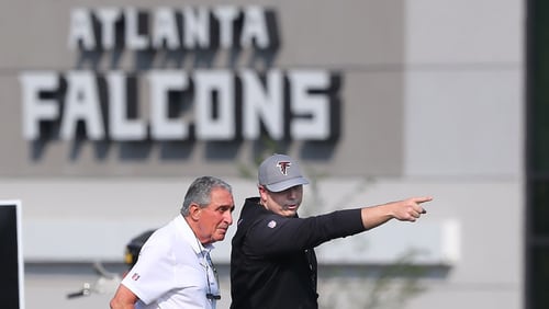 Falcons owner Arthur Blank (left) looks on as new head coach Arthur Smith makes a point as they take in the first day of practice during training camp Thursday, July 29, 2021, at the team's training facility in Flowery Branch. (Curtis Compton / Curtis.Compton@ajc.com)