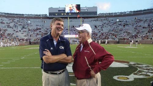 Georgia Tech coach Paul Johnson visits with Florida State coach Bobby Bowden before Saturday night's game in Tallahassee.