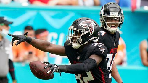 Falcons safety Jaylinn Hawkins (32) reacts after intercepting a pass in the end zone intended for Miami Dolphins tight end Durham Smythe during the first half Sunday, Oct. 24, 2021, in Miami Gardens, Fla. (Wilfredo Lee/AP)