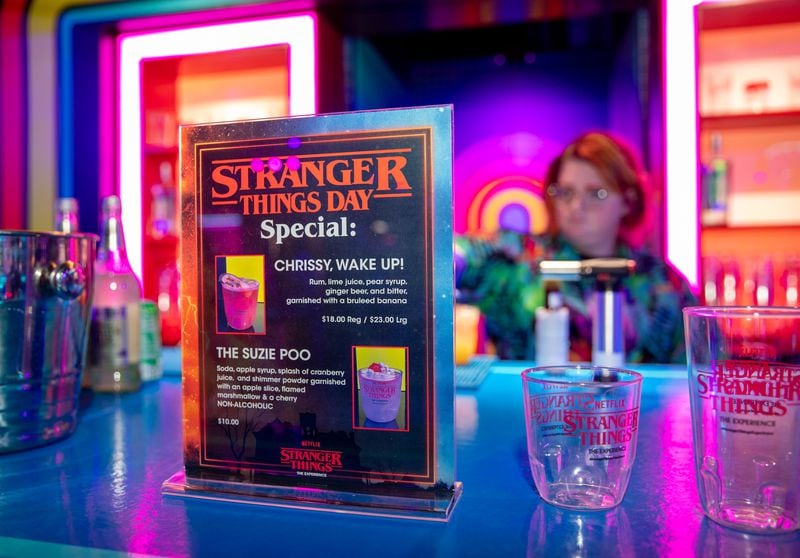 "Stranger Things: The Experience" at Pullman Yards ends in the Mix-Tape lounge where The Upside bar has themed cocktails and mocktails, ice cream, pizza, merchandise and photo opportunities.  (Jenni Girtman for The Atlanta Journal-Constitution)
