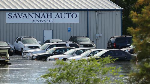 Many vehicles sit in flood waters at Savannah Auto in the aftermath of Hurricane Matthew on Saturday, Oct. 8, 2016, in Savannah. Curtis Compton /ccompton@ajc.com