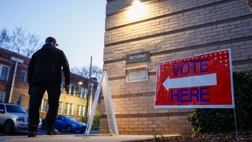 A voter walks into the Joan P. Garner Library in Atlanta as the polls open for the Georgia presidential primary on Tuesday, March 12, 2024. Miguel Martinez /miguel.martinezjimenez@ajc.com