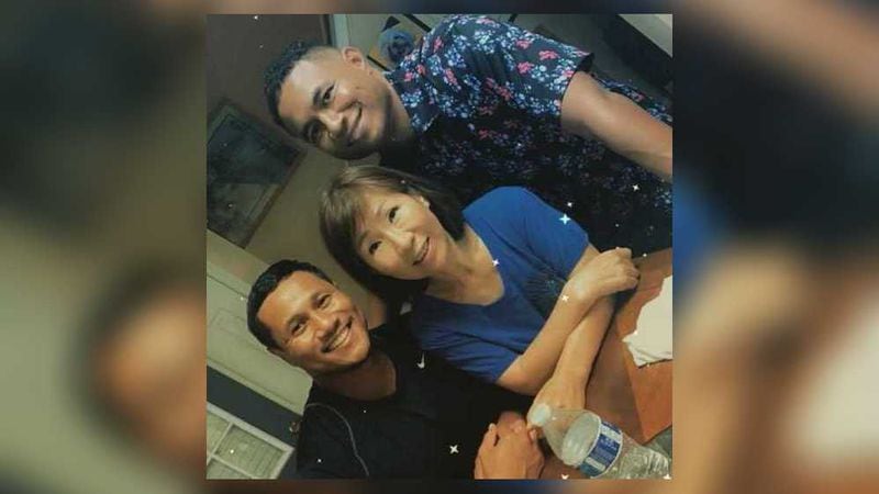 Yong Yue with her sons, Elliott Peterson and Robert Peterson. The 63-year-old was one of eight people killed Tuesday when a 21-year-old gunman went on a shooting spree at three metro Atlanta spas, authorities said. 
