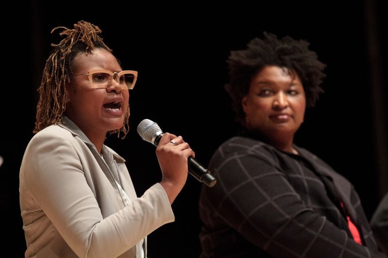 State Rep. Park Cannon talks as gubernatorial candidate Stacey Abrams looks on during the Town Hall For Our Lives at the Rialto Center for the Arts in Atlanta on Saturday, April 7, 2018. Another metro Atlanta town hall was held earlier in the day in Conyers and included invited speaker U.S. Rep. Hank Johnson. Students organized the town halls around the nation on Saturday to spotlight gun violence and school safety. STEVE SCHAEFER / SPECIAL TO THE AJC