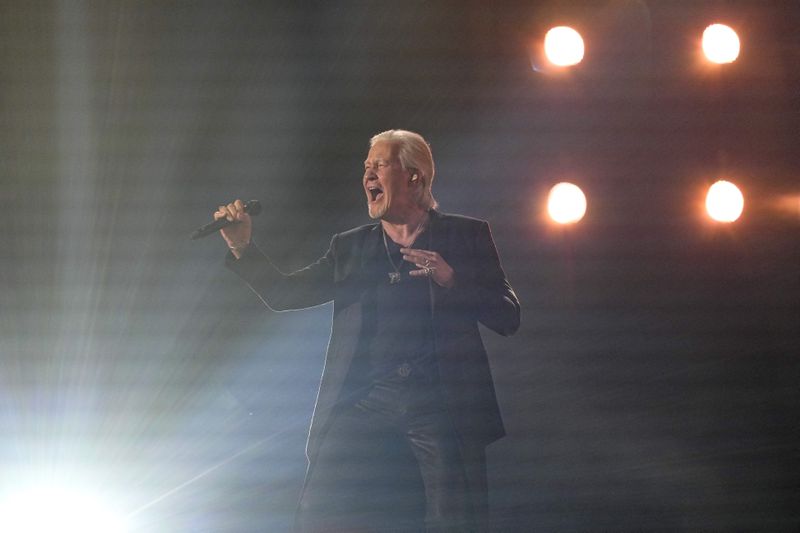 Johnny Logan of Ireland, two-time Eurovision winner, performs the song Euphoria during the first semi-final at the Eurovision Song Contest in Malmo, Sweden, Tuesday, May 7, 2024. (AP Photo/Martin Meissner)