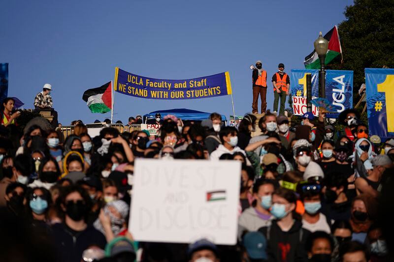 Demonstrators gather on the UCLA campus, after nighttime clashes between Pro-Israel and Pro-Palestinian groups, Wednesday, May 1, 2024, in Los Angeles. (AP Photo/Ryan Sun)