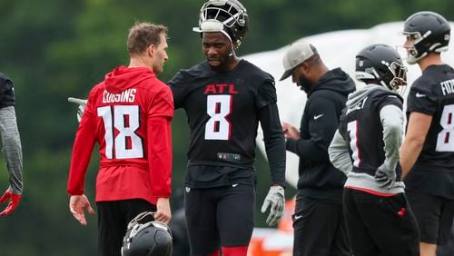 Atlanta Falcons quarterback Kirk Cousins (18) talks with tight end Kyle Pitts (8) during minicamp at the Atlanta Falcons Training Camp, Tuesday, May 14, 2024, in Flowery Branch, Ga. (Jason Getz / AJC)
