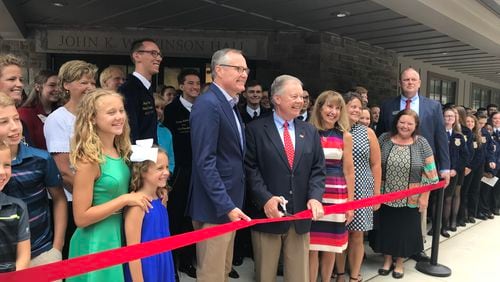 Lt. Gov. Casey Cagle, left center, and state senator John Wilkinson cut the ribbon to officially open the new John K. Wilkinson Hall at the Georgia FFA-FCCLA Center in Covington.