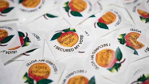
                        FILE -- Stickers for voters in the Georgia primary election in Atlanta, March 12, 2024. Vote history data in Georgia supports the polling that’s showing President Joe Biden doing well among highly engaged voters but lagging overall. (Nicole Craine/The New York Times)
                      